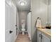 Light-filled bathroom with modern fixtures, white cabinets and updated design at 5726 N Genoa Way # 201, Aurora, CO 80019