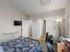 Spacious bedroom featuring a large bed, neutral walls, and ample closet space at 5726 N Genoa Way # 201, Aurora, CO 80019