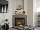 Cozy fireplace with decorative mantel and stone surround at 5726 N Genoa Way # 201, Aurora, CO 80019