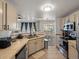 Updated kitchen with tile floors, stainless steel appliances, and modern countertops at 5726 N Genoa Way # 201, Aurora, CO 80019