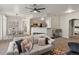 Open-concept living area connects seamlessly to the kitchen and dining space, creating a warm and inviting atmosphere at 5726 N Genoa Way # 201, Aurora, CO 80019