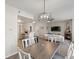 Open-concept living room with fireplace, modern lighting, and sleek design at 5726 N Genoa Way # 201, Aurora, CO 80019