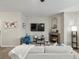 Enjoy this living room featuring a cozy fireplace, stylish decor, and plenty of space for relaxation and entertainment at 5726 N Genoa Way # 201, Aurora, CO 80019