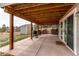 Covered backyard patio with a grill, and direct access to the yard and outdoor amenities at 1233 Starling Ln, Elizabeth, CO 80107