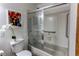 This bathroom features tiled walls and a shower with sliding doors at 1233 Starling Ln, Elizabeth, CO 80107