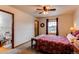 Cozy bedroom featuring carpeted floors, natural light, and an attached bathroom with a view of the window at 1233 Starling Ln, Elizabeth, CO 80107