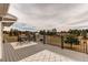 Spacious outdoor deck area with metal railing, outdoor seating, and scenic views of the surrounding landscape at 1233 Starling Ln, Elizabeth, CO 80107