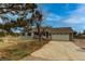 Charming single-Gathering home featuring a two-car garage, covered front porch, and landscaped front yard at 1233 Starling Ln, Elizabeth, CO 80107