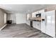 Bright kitchen with white cabinets, stainless appliances and dark countertops at 1233 Starling Ln, Elizabeth, CO 80107