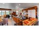 Open kitchen with an island, ample cabinet space, and granite countertops at 1233 Starling Ln, Elizabeth, CO 80107