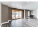Open living room with sliding glass doors out to the backyard at 1233 Starling Ln, Elizabeth, CO 80107