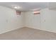 Bedroom with carpeted floor, neutral paint, and window wells allowing for natural light at 4755 S Irving St, Englewood, CO 80110