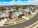 Aerial view of a community with a home, green lawns, landscaping and other neighborhood homes at 6705 S Catawba Way, Aurora, CO 80016