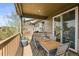 Charming balcony with outdoor seating, a heater, and sliding glass doors leading indoors at 6705 S Catawba Way, Aurora, CO 80016