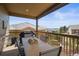 Inviting covered balcony featuring an outdoor dining set, perfect for enjoying the views at 6705 S Catawba Way, Aurora, CO 80016