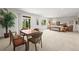 Spacious finished basement with a dining area, large windows, and cozy seating area at 6705 S Catawba Way, Aurora, CO 80016