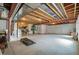 Spacious unfinished basement with visible ceiling beams, concrete floor and workout equipment at 6705 S Catawba Way, Aurora, CO 80016