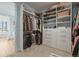 Spacious walk-in closet with custom shelving and drawers, offering ample storage at 6705 S Catawba Way, Aurora, CO 80016
