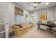 Comfortable home office with a stylish sofa, natural light, and a functional desk setup at 6705 S Catawba Way, Aurora, CO 80016