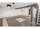 Unfurnished basement featuring tile flooring and a staircase at 13017 W 20Th Ave, Golden, CO 80401