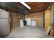 Unfinished basement features a utility sink, shelving, and plenty of storage space at 13017 W 20Th Ave, Golden, CO 80401