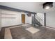 Unfurnished basement featuring tile flooring and a staircase at 13017 W 20Th Ave, Golden, CO 80401
