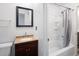 This bathroom features a shower and tub combination at 13017 W 20Th Ave, Golden, CO 80401