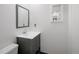 This bathroom features a sink with granite countertop and toilet at 13017 W 20Th Ave, Golden, CO 80401