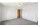 This bedroom has carpet, a ceiling fan and two closets at 13017 W 20Th Ave, Golden, CO 80401