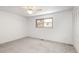 This bedroom has carpet and a window at 13017 W 20Th Ave, Golden, CO 80401
