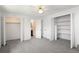 This bedroom has carpet, a ceiling fan and two closets at 13017 W 20Th Ave, Golden, CO 80401