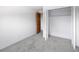 Bedroom with soft carpet, closet, and door leading to the other rooms at 13017 W 20Th Ave, Golden, CO 80401