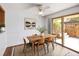 This dining room features a sliding glass door and a ceiling fan at 13017 W 20Th Ave, Golden, CO 80401