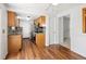 The kitchen has stainless steel appliances, wooden cabinets, and is open to the dining area at 13017 W 20Th Ave, Golden, CO 80401