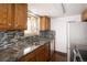 The kitchen features granite countertops and mosaic backsplash at 13017 W 20Th Ave, Golden, CO 80401