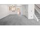 The expansive living room showcases new gray carpet and an open layout at 13017 W 20Th Ave, Golden, CO 80401