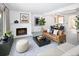 Bright living room with a cozy fireplace, stylish decor, and an open floor plan at 13017 W 20Th Ave, Golden, CO 80401