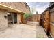 Private patio area with wooden fence and sliding glass door access to the house at 13017 W 20Th Ave, Golden, CO 80401