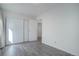 Bedroom featuring a closet with sliding doors and laminate floors at 3164 S Wheeling Way # 101, Aurora, CO 80014