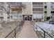 Exterior of building with a walkway, building sign, snow, landscaping, and ramp access at 3164 S Wheeling Way # 101, Aurora, CO 80014