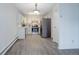 Kitchen with stainless steel appliances, gray vinyl floors and white cabinets at 3164 S Wheeling Way # 101, Aurora, CO 80014