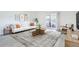 Elegant living room with contemporary decor, a cozy sofa, and a sunroom offering natural light at 3164 S Wheeling Way # 101, Aurora, CO 80014