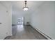 Spacious living room with sliding glass door and gray vinyl floors at 3164 S Wheeling Way # 101, Aurora, CO 80014