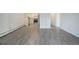 Open concept living room and kitchen area with gray vinyl floors at 3164 S Wheeling Way # 101, Aurora, CO 80014