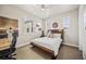 Bright bedroom with a large bed, decor, and natural light from multiple windows at 10401 Maplebrook Way, Highlands Ranch, CO 80126