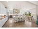Open-concept kitchen and dining area with hardwood floors and modern finishes at 10401 Maplebrook Way, Highlands Ranch, CO 80126