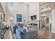 Elegant kitchen with a large center island, pendant lighting, stainless steel appliances, and an adjacent dining area at 10401 Maplebrook Way, Highlands Ranch, CO 80126
