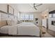 Spacious main bedroom with a large window and fireplace, offering a comfortable retreat at 10401 Maplebrook Way, Highlands Ranch, CO 80126