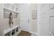 Well-organized mudroom with built-in storage and convenient access to the home at 10401 Maplebrook Way, Highlands Ranch, CO 80126