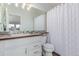 Bathroom featuring mosaic tiles, white cabinets, and a shower with a curtain at 4676 S Dillon Ct # G, Aurora, CO 80015